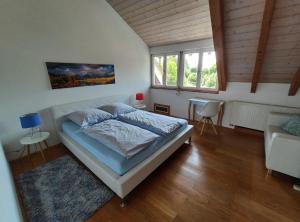 מיטה או מיטות בחדר ב-Ferienhaus Feder