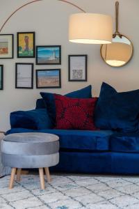 a living room with a blue couch and a table at Turnberry accommodation in Turnberry