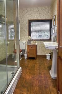 a bathroom with a sink and a shower at Hodgkinsons Hotel & Restaurant in Matlock