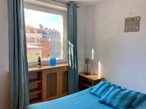 Łóżko lub łóżka w pokoju w obiekcie Kierunek Sopot CENTRUM