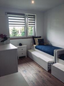 Postel nebo postele na pokoji v ubytování DOMEK U MARKA Zator