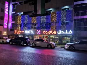 a group of cars parked in front of a hotel at Saffron Hotel in Dubai