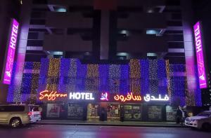 a hotel is decorated with purple and blue lights at Saffron Hotel in Dubai