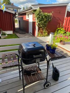 a grill sitting on top of a picnic table at Centrally located spacious Townhouse with large patios and a Fireplace in Boden