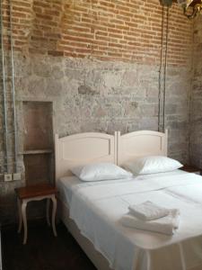 Postel nebo postele na pokoji v ubytování Kidalyo Hotel - Special Category