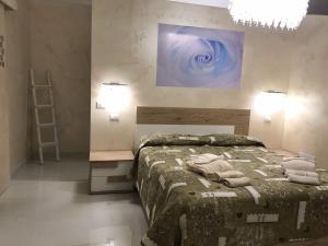 Кровать или кровати в номере La Stella d'oro