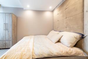 Postel nebo postele na pokoji v ubytování APARTVIP Akademicka