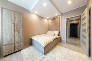 Postel nebo postele na pokoji v ubytování APARTVIP Akademicka