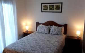เตียงในห้องที่ Comoda casa con inmejorable ubicación y servicios