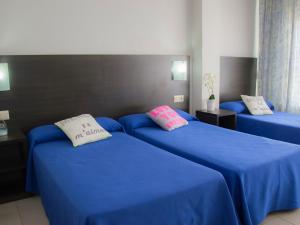 Postel nebo postele na pokoji v ubytování Hotel Safari
