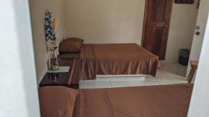 En eller flere senge i et værelse på Hotel Mirador Maya Calakmul