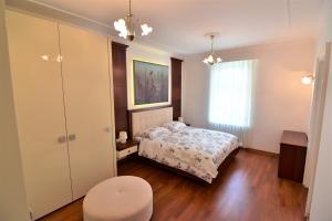 a small bedroom with a bed and a window at Vila Ključe Apartments in Bled +72 photos