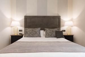 Een bed of bedden in een kamer bij Hotel Palacete de Alamos