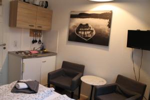 TV a/nebo společenská místnost v ubytování Apartment am Wall