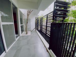 a balcony of a house with a black fence at 遊虎尾 in Huwei