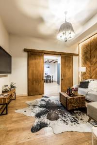 a living room with a couch and a table at Apartamenty ForRest Nowotarska in Zakopane