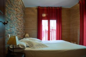 A bed or beds in a room at Apartamentos Turísticos Toledo