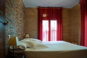 Ένα ή περισσότερα κρεβάτια σε δωμάτιο στο Apartamentos Turísticos Toledo