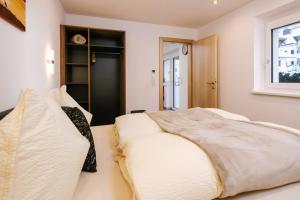Posteľ alebo postele v izbe v ubytovaní Apart Scharler mit Silvretta Card