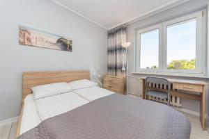 Posteľ alebo postele v izbe v ubytovaní House Managers - Nadmorski - z widokiem na morze
