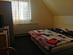 En eller flere senger på et rom på Privat Bohemia