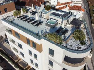 an aerial view of a building with a swimming pool at Villa Unique 9 in Podstrana