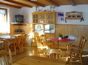 a kitchen and dining room with a table and chairs at Family Home, Bohinj - Bled in Bohinj