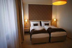 Letto o letti in una camera di Hotel Pod Vlekem