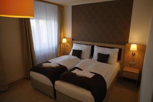 Letto o letti in una camera di Hotel Pod Vlekem