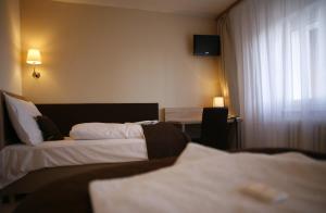 Letto o letti in una camera di Hotel Pod Vlekem