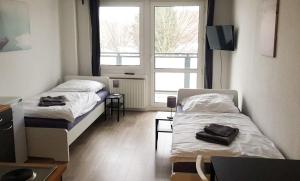 Llit o llits en una habitació de Work & Stay Apartment