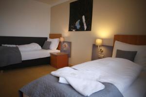 Letto o letti in una camera di Hotel Pod Vlekem