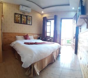 Postel nebo postele na pokoji v ubytování Dang Khoa Garden Inn Homestay