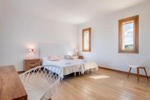 Ein Bett oder Betten in einem Zimmer der Unterkunft Finca Sa Era by Mallorca House Rent