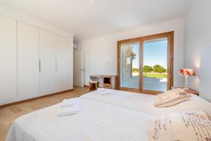 Ein Bett oder Betten in einem Zimmer der Unterkunft Finca Sa Era by Mallorca House Rent