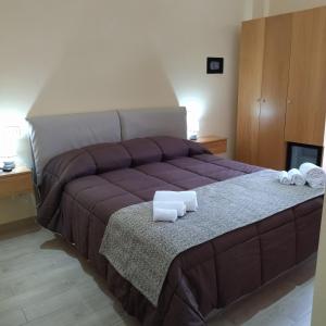 A bed or beds in a room at B&B Alfa & Phi