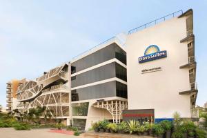 a rendering of the front of a building at Days Inn & Suites by Wyndham Bengaluru Whitefield in Bangalore