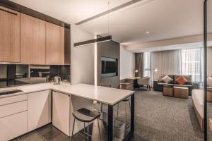 an open kitchen and living room in a apartment at Hyatt House Kuala Lumpur, Mont Kiara in Kuala Lumpur