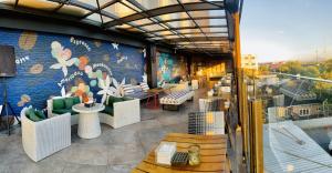 a restaurant with a mural on the side of a building at Kyriad Hotel Muraya Aceh in Banda Aceh