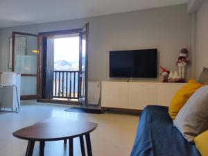 TV a/nebo společenská místnost v ubytování Apartamento Casa Pueyo + 5 fotografií