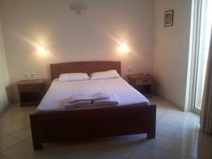 Postel nebo postele na pokoji v ubytování Ostria Hotel