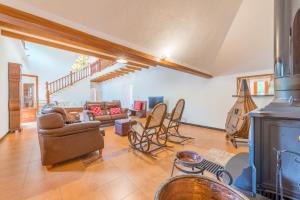 a living room with a couch and a fireplace at Finca Es Rafalot de Dalt by Mallorca House Rent in Manacor