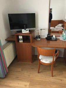 TV a/nebo společenská místnost v ubytování Seminar- und Urlaubshotel Schulz