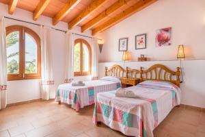 Voodi või voodid majutusasutuse Finca Can Pereta by Mallorca House Rent toas +29 fotot