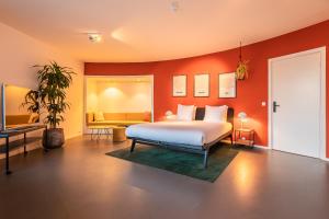 Postel nebo postele na pokoji v ubytování Gooiland Hotel