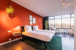 Postel nebo postele na pokoji v ubytování Gooiland Hotel
