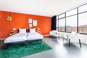 Postel nebo postele na pokoji v ubytování Gooiland Hotel