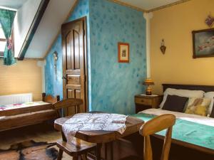 a bedroom with a bed and a table in it at Stara Vodenica in Klanjec +81 photos