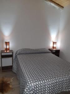 Uma cama ou camas num quarto em El Nevado Casa de Campo
