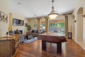 a living room with a couch and a table at Grand Ironhorse in Queen Creek